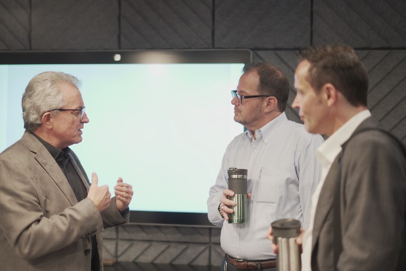 Jimmy talking with Trevor and Jeffrey Dupuis